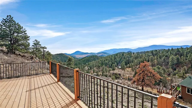 a view of a balcony with wooden fence