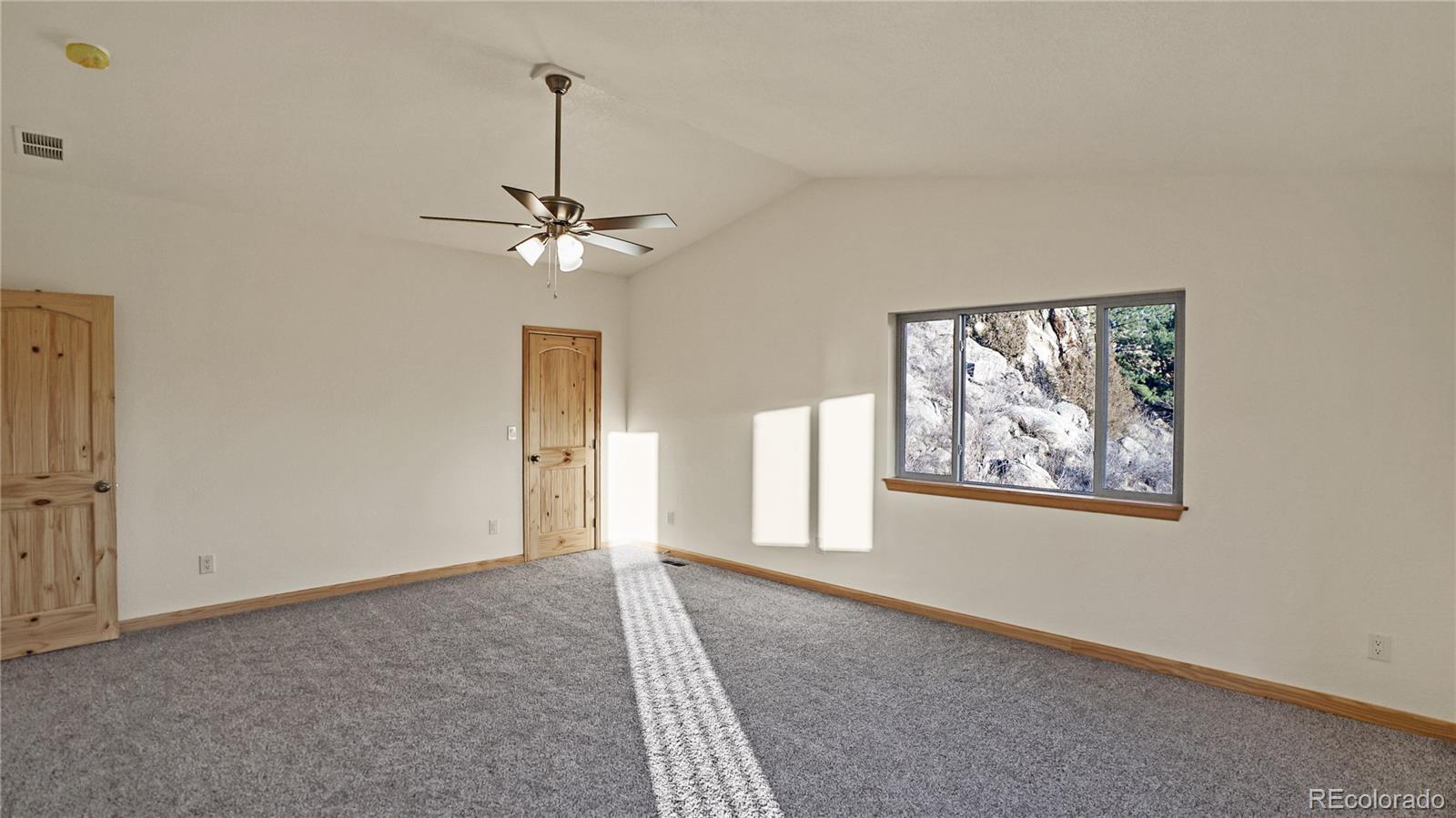 209 Fawn Road Bailey, CO 80421 - Photo 13 of 27 a view of an empty room with a window