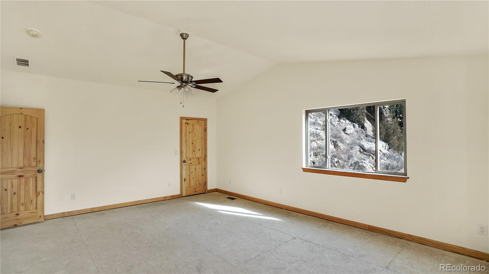 209 Fawn Road Bailey, CO 80421 - Photo 15 of 26 a view of a livingroom with a stove and a refrigerator