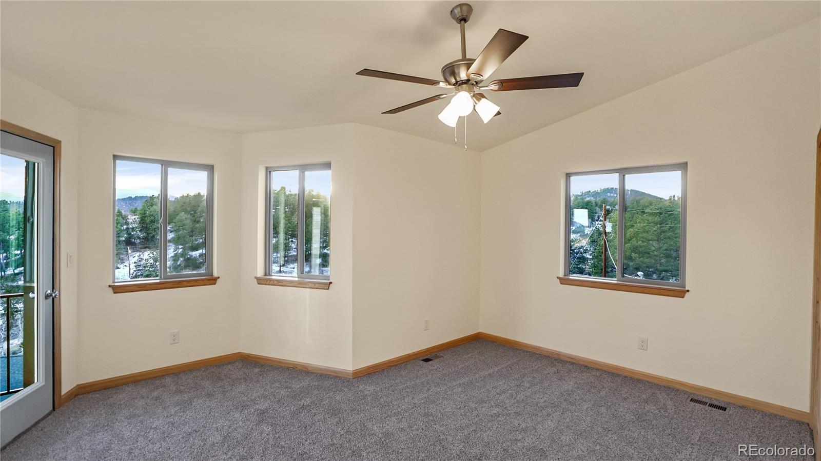 209 Fawn Road Bailey, CO 80421 - Photo 19 of 27 a view of an empty room with a window