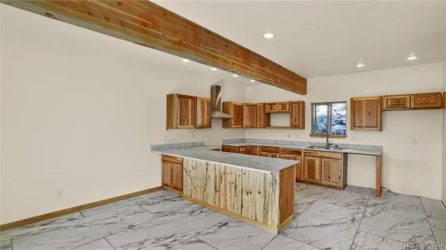 a kitchen with a sink and cabinets