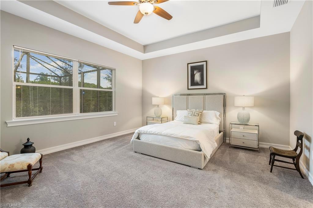 14586 Kelson Circle Naples, FL 34114 - Photo 14 of 35 a bedroom with a bed and a window