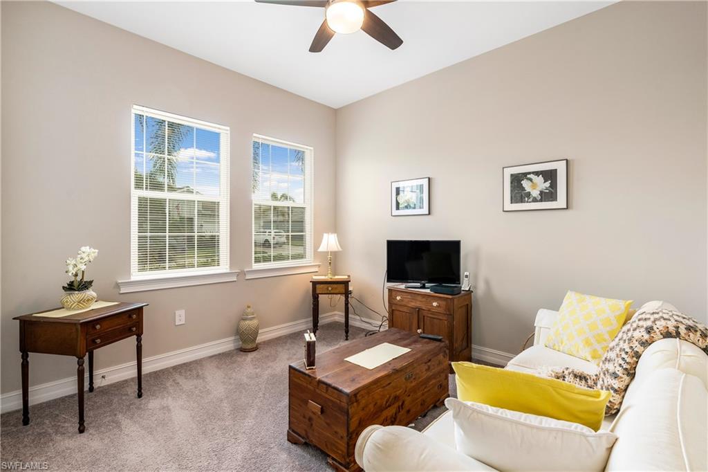 14586 Kelson Circle Naples, FL 34114 - Photo 19 of 35 a living room with furniture and a flat screen tv