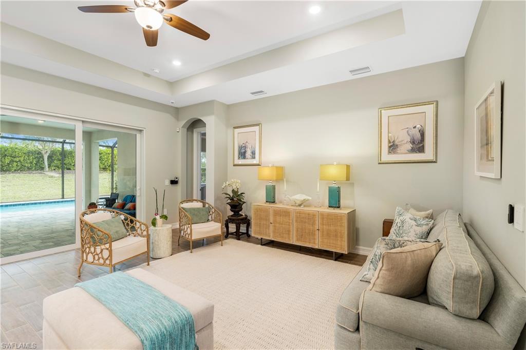 14586 Kelson Circle Naples, FL 34114 - Photo 4 of 35 a living room with furniture and a large window