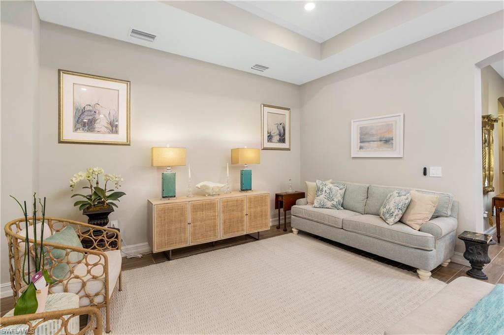 14586 Kelson Circle Naples, FL 34114 - Photo 5 of 35 a living room with furniture and a couch