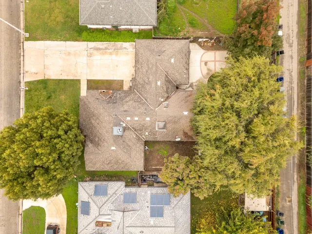 an aerial view of residential houses with outdoor space