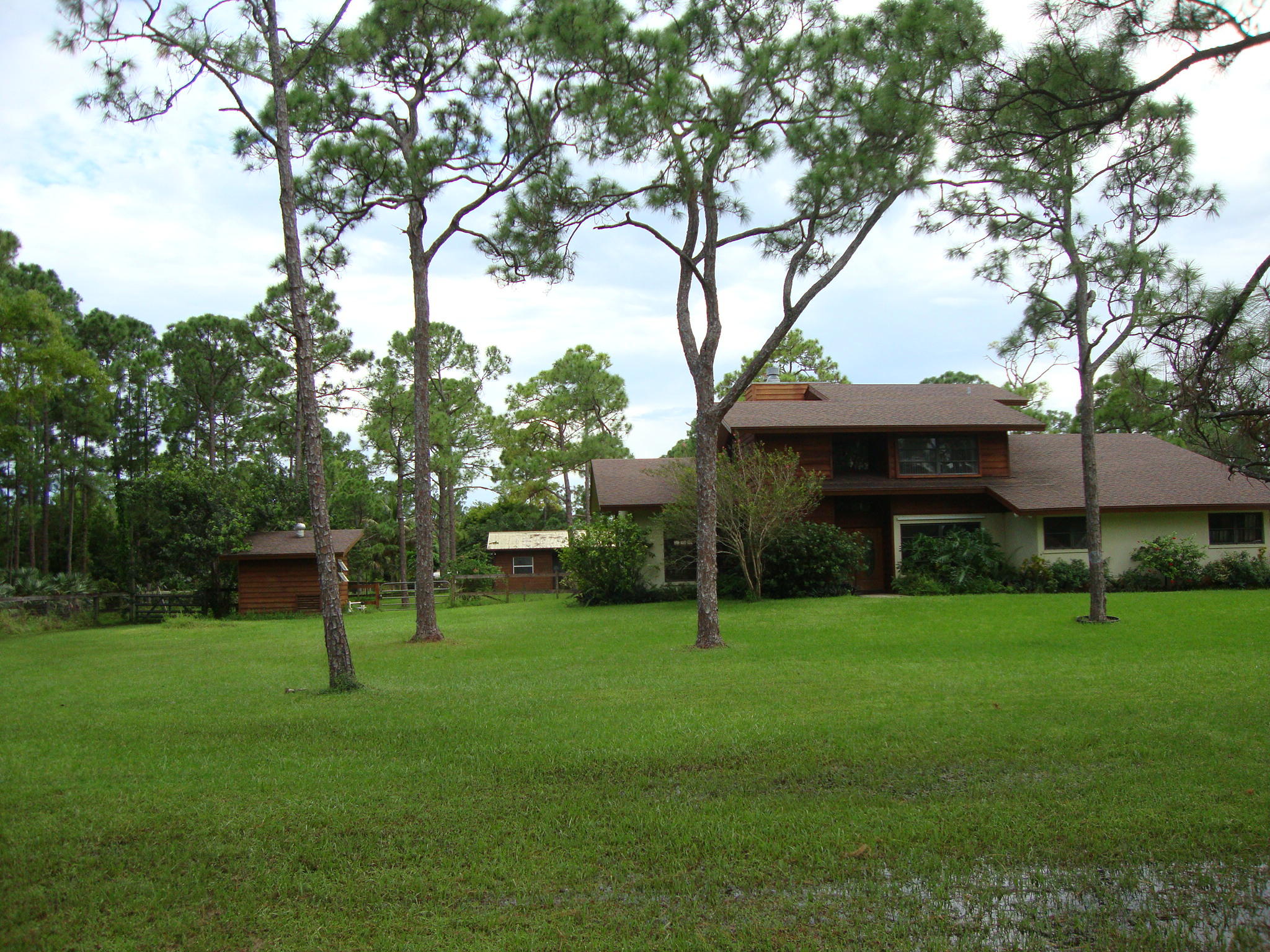 12668 Sandy Run Road Jupiter, FL 33478 - Photo 1 of 22 a view of a house with a yard