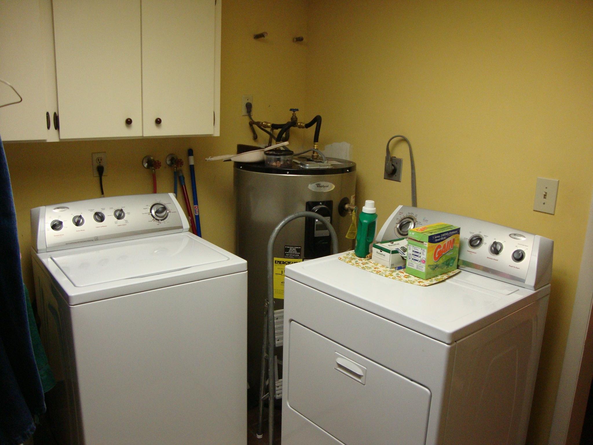 12668 Sandy Run Road Jupiter, FL 33478 - Photo 20 of 22 a utility room with dryer and washer
