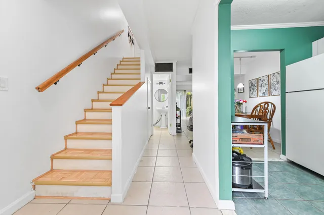 a view of a hallway with seating space