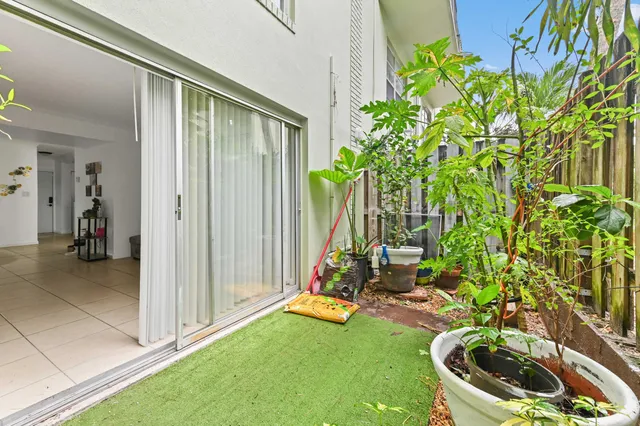 a view of a backyard with swimming pool
