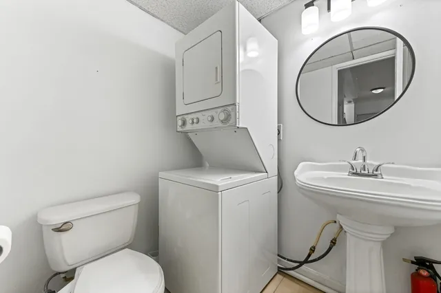 a bathroom with a toilet and a sink