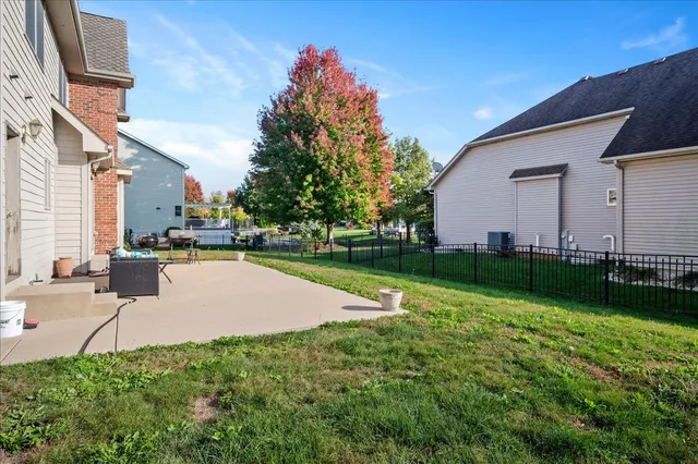 a view of a backyard of the house