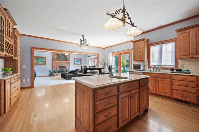 a open kitchen with stainless steel appliances granite countertop a sink stove and refrigerator