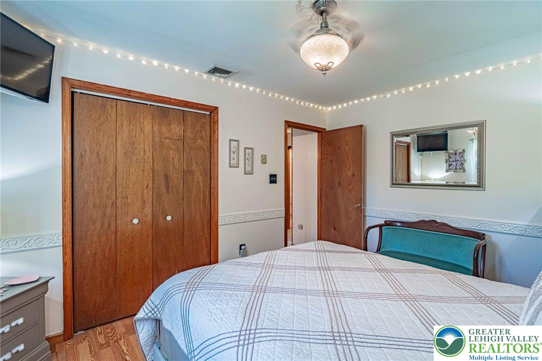 341 Lower Greenhill Road Kunkletown, PA 18058 - Photo 26 of 69 Wood floors and a spacious closet create a cozy bedroom retreat.