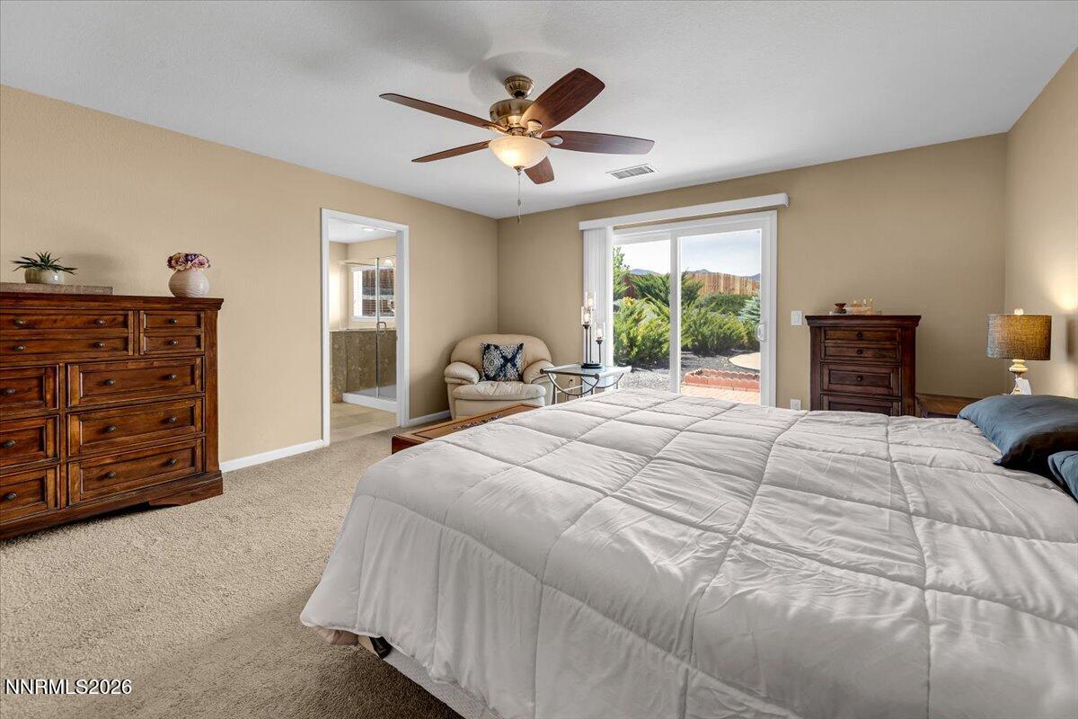 104 Bethpage Road Dayton, NV 89403 - Photo 24 of 65 a bedroom with a large bed and a window