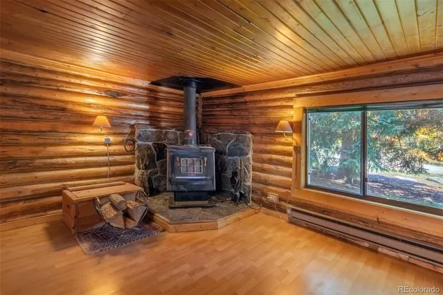 a view of a patio with a table chairs and wooden fence