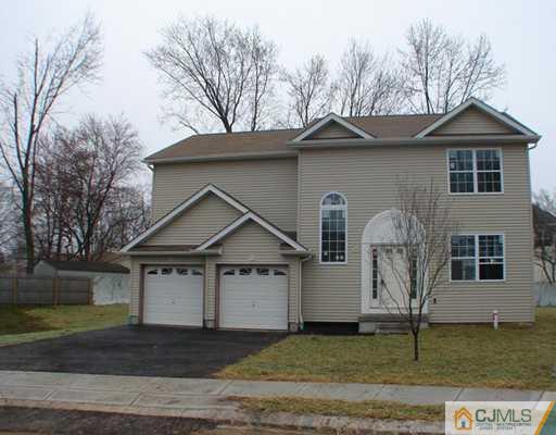 962 Clark Road North Brunswick, NJ 08902 - Photo 1 of 10 a front view of a house with a yard