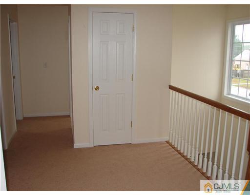 962 Clark Road North Brunswick, NJ 08902 - Photo 7 of 10 a view of an empty room with wooden floor