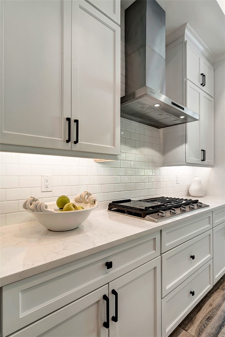 325 Holly Road Vero Beach, FL 32963 - Photo 11 of 25 a kitchen with stainless steel appliances granite countertop a sink and a stove