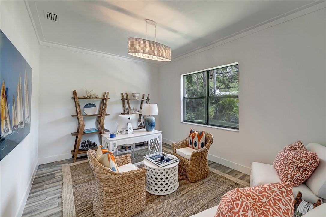 325 Holly Road Vero Beach, FL 32963 - Photo 16 of 25 a living room with furniture and a window
