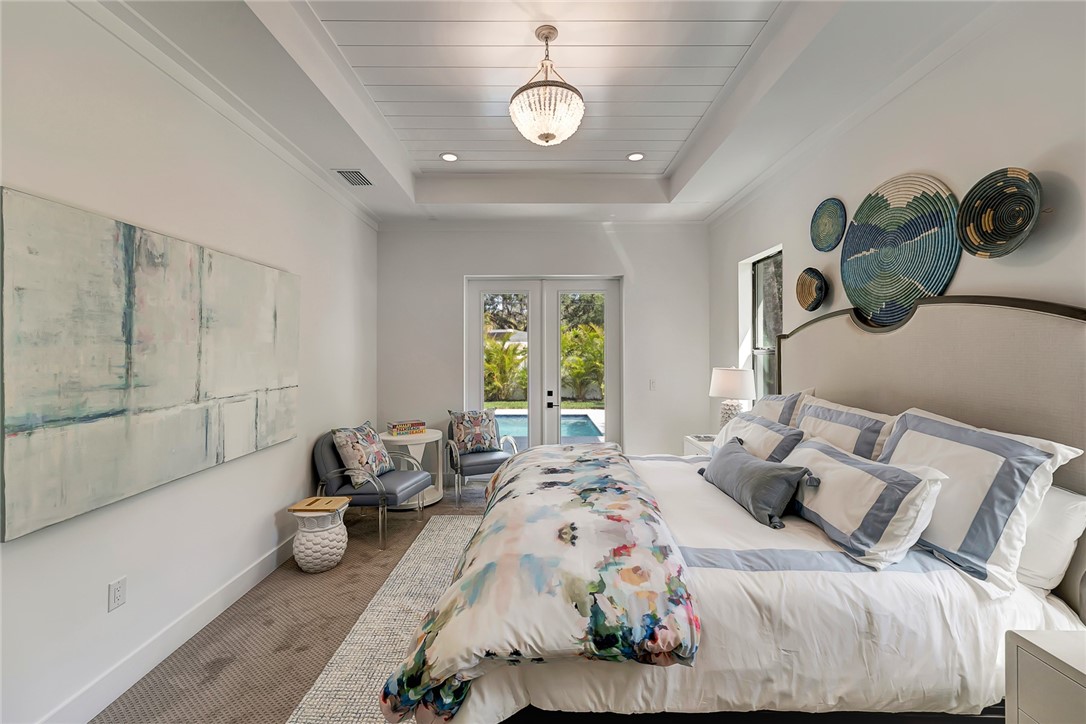 325 Holly Road Vero Beach, FL 32963 - Photo 17 of 25 a bedroom with bed and windows