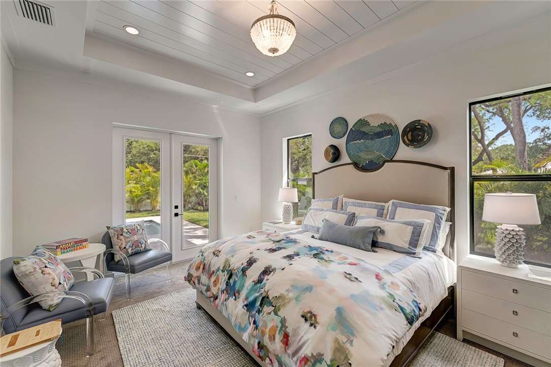 325 Holly Road Vero Beach, FL 32963 - Photo 18 of 25 a bedroom with a bed and window