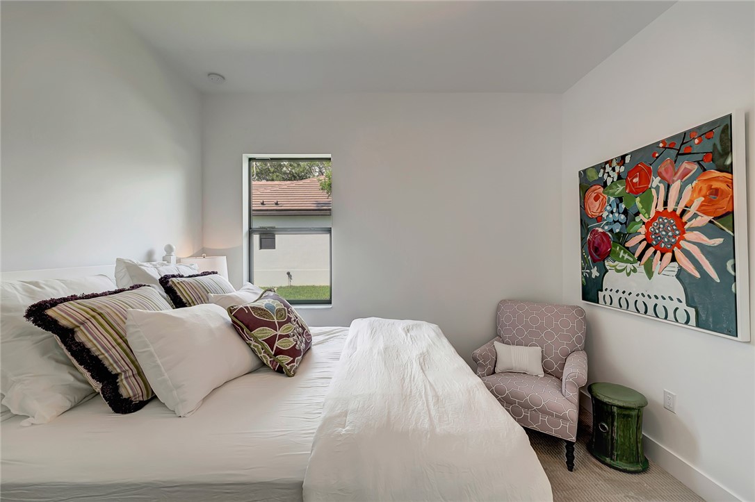 325 Holly Road Vero Beach, FL 32963 - Photo 20 of 25 a bedroom with a bed and a couch