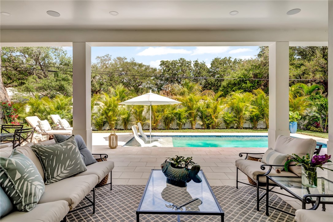 325 Holly Road Vero Beach, FL 32963 - Photo 21 of 25 a living room with furniture and a garden