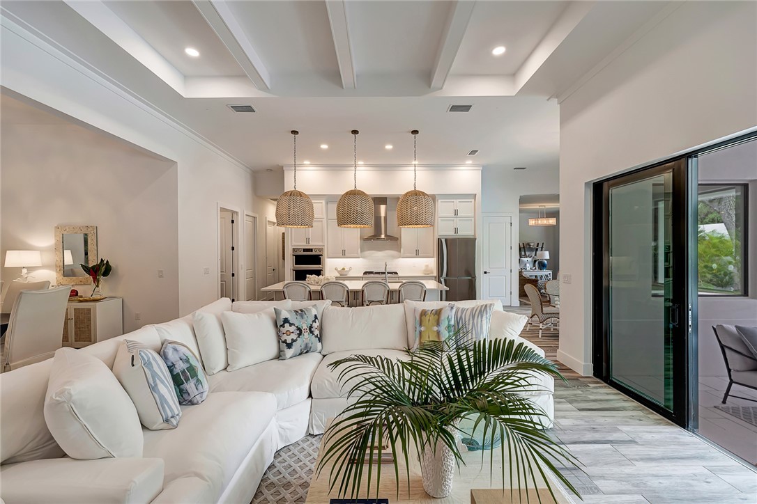 325 Holly Road Vero Beach, FL 32963 - Photo 4 of 25 a living room with furniture and a large window
