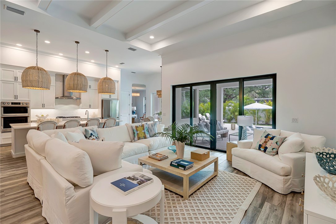 325 Holly Road Vero Beach, FL 32963 - Photo 5 of 25 a living room with furniture and a large window