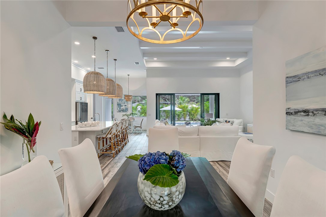 325 Holly Road Vero Beach, FL 32963 - Photo 7 of 25 a living room with furniture and a large window