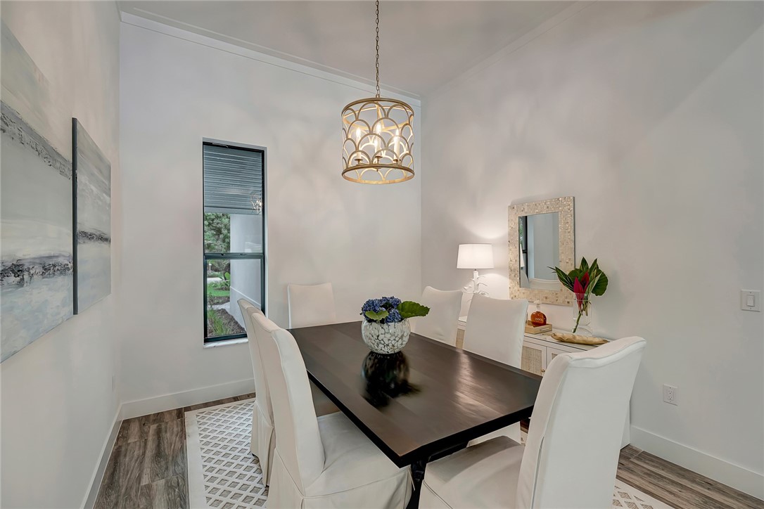 325 Holly Road Vero Beach, FL 32963 - Photo 8 of 25 a view of a dining room with a table and chairs