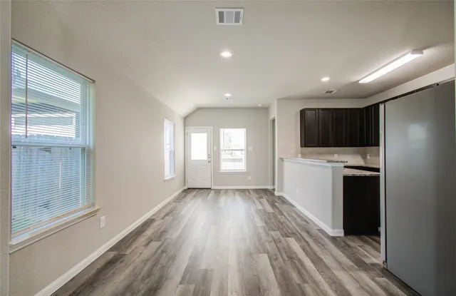 a view of a kitchen from the hallway