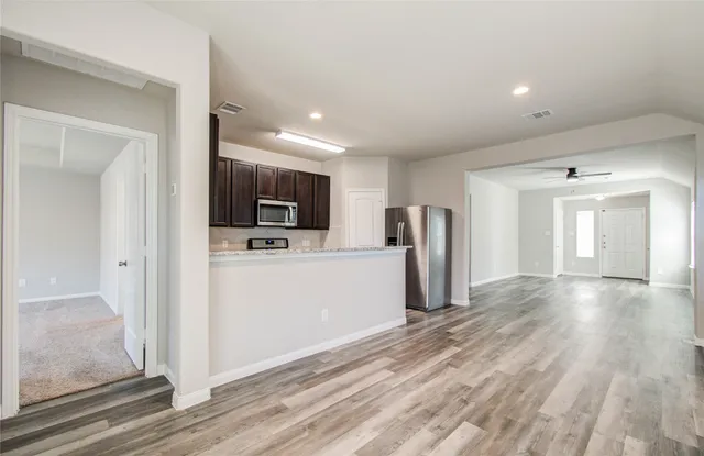 a view of a kitchen with a sink and an oven
