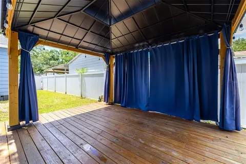 a view of a backyard of the house