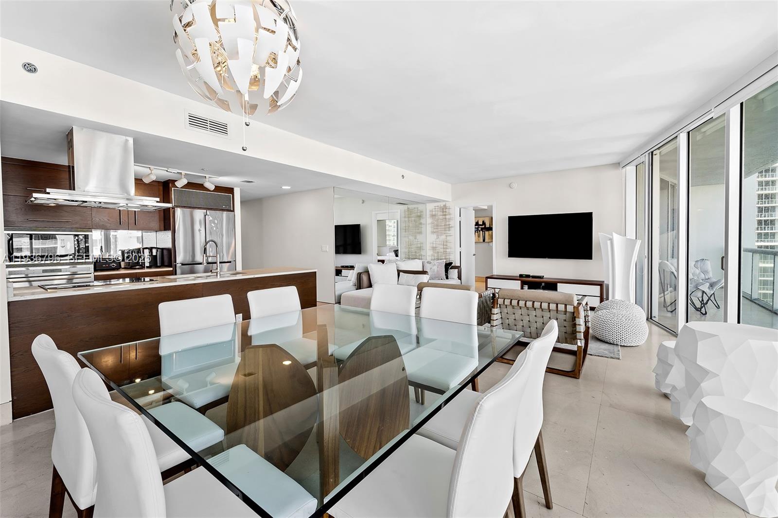 495 Brickell Avenue, Unit 2904 Miami, FL 33131 - Photo 11 of 29 a living room with furniture kitchen view and a large window