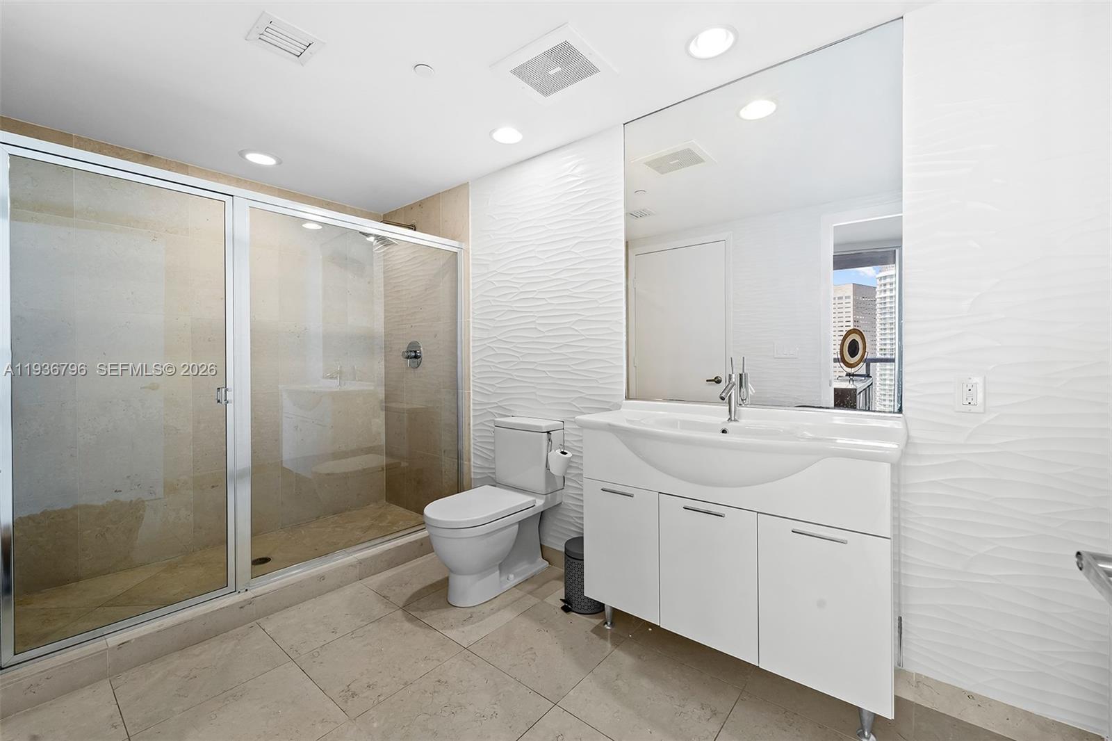 495 Brickell Avenue, Unit 2904 Miami, FL 33131 - Photo 18 of 29 a bathroom with a toilet sink and shower