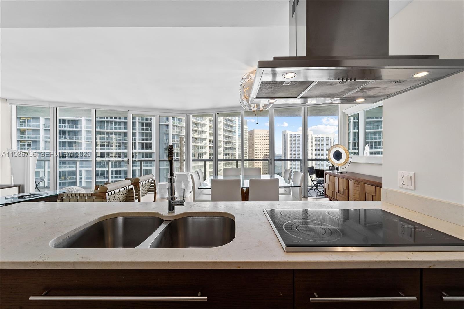 495 Brickell Avenue, Unit 2904 Miami, FL 33131 - Photo 19 of 29 a kitchen with a sink and a counter top space