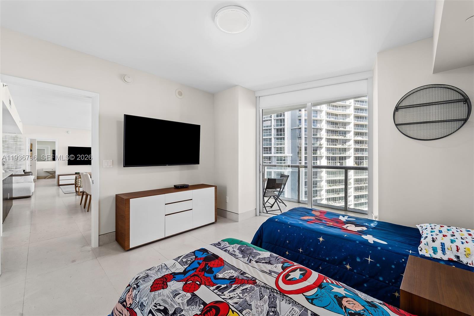 495 Brickell Avenue, Unit 2904 Miami, FL 33131 - Photo 21 of 29 a living room with furniture and a flat screen tv