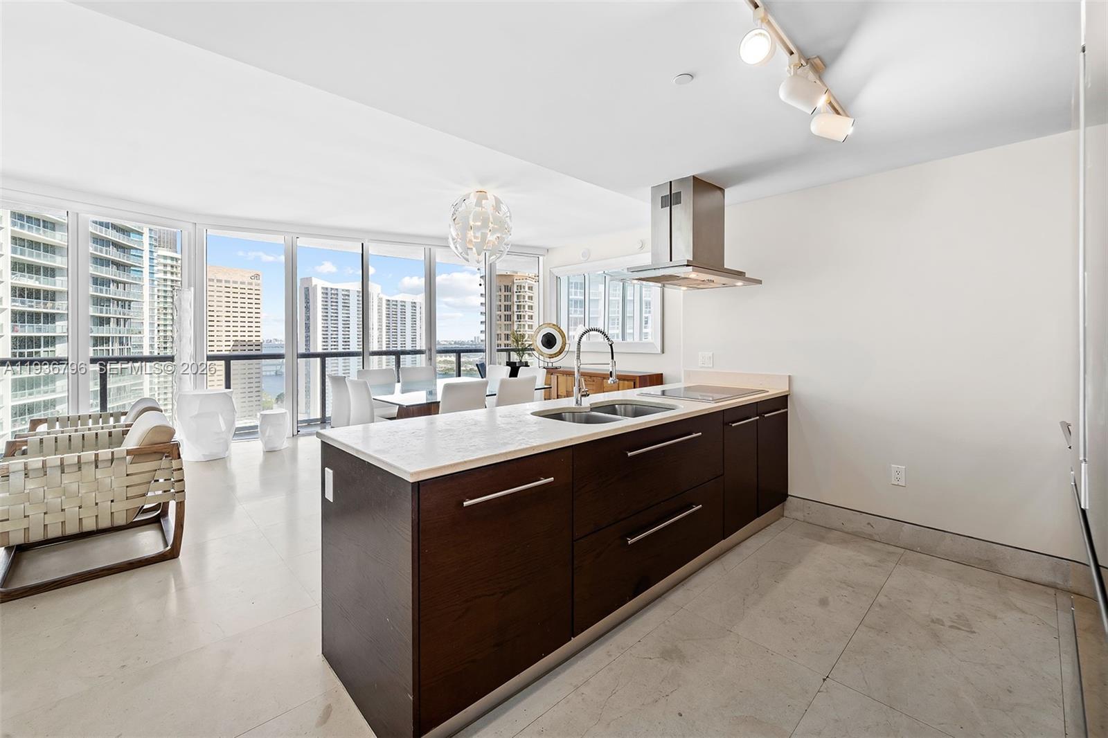 495 Brickell Avenue, Unit 2904 Miami, FL 33131 - Photo 3 of 29 a kitchen with a sink and a stove top oven