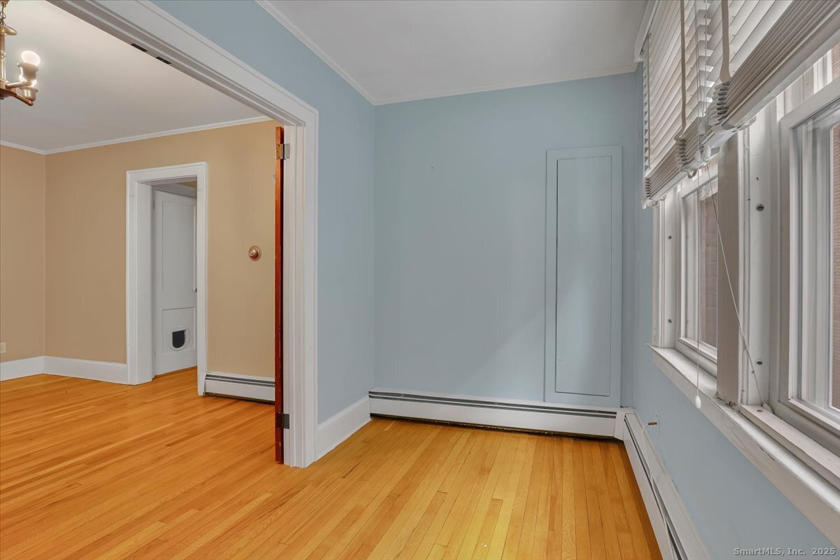 40 Robin Road, Unit 203 West Hartford, CT 06119 - Photo 12 of 22 a view of a room with wooden floor and tub