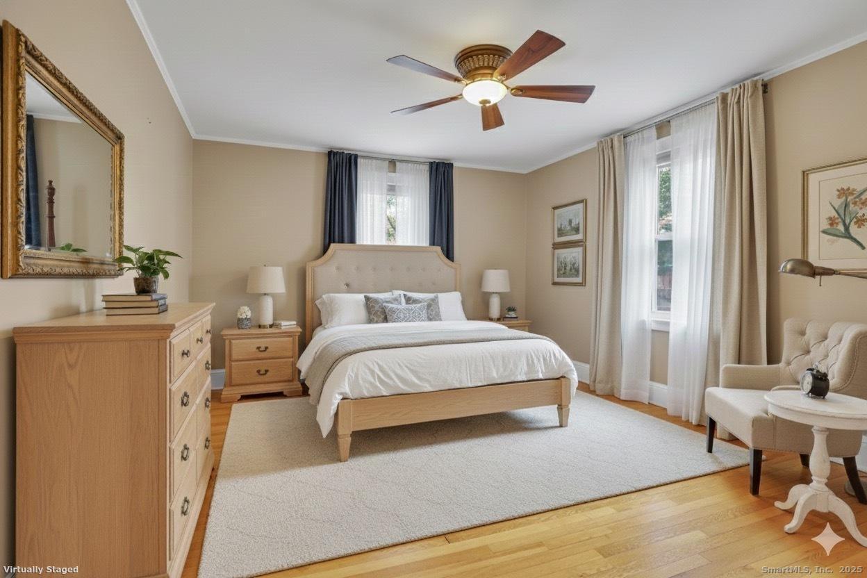 40 Robin Road, Unit 203 West Hartford, CT 06119 - Photo 14 of 22 a bedroom with a bed chandelier and a window