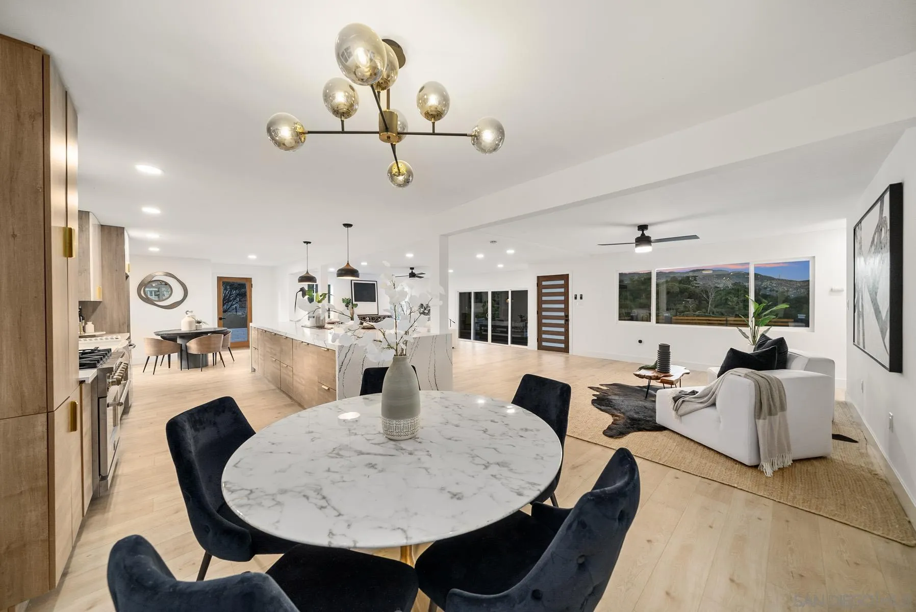 11442 Pinehurst Drive Lakeside, CA 92040 - Photo 15 of 46 a view of a dining room with furniture wooden floor and chandelier