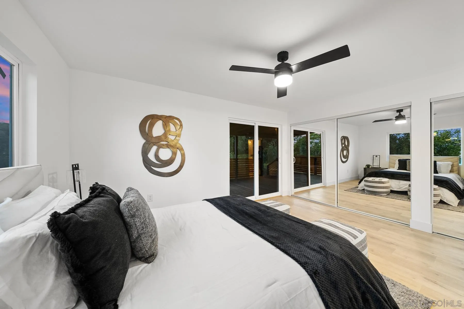 11442 Pinehurst Drive Lakeside, CA 92040 - Photo 28 of 46 a bedroom with a bed and a large mirror with a chandelier