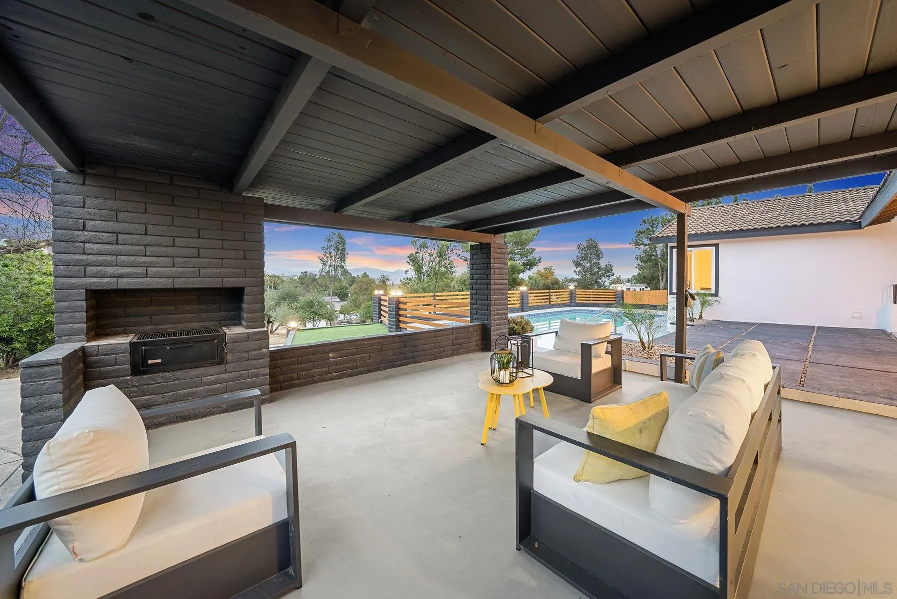 11442 Pinehurst Drive Lakeside, CA 92040 - Photo 35 of 46 a living room with furniture a fireplace and a large window