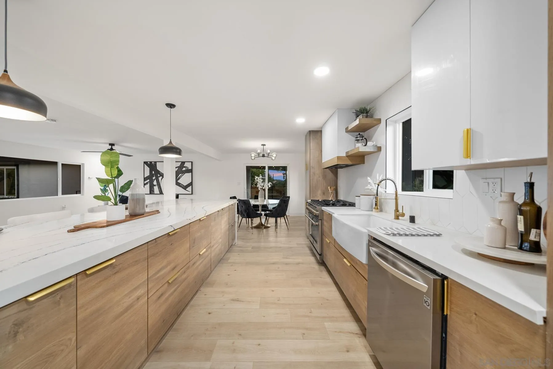 11442 Pinehurst Drive Lakeside, CA 92040 - Photo 8 of 46 a large white kitchen with lots of counter space and sink