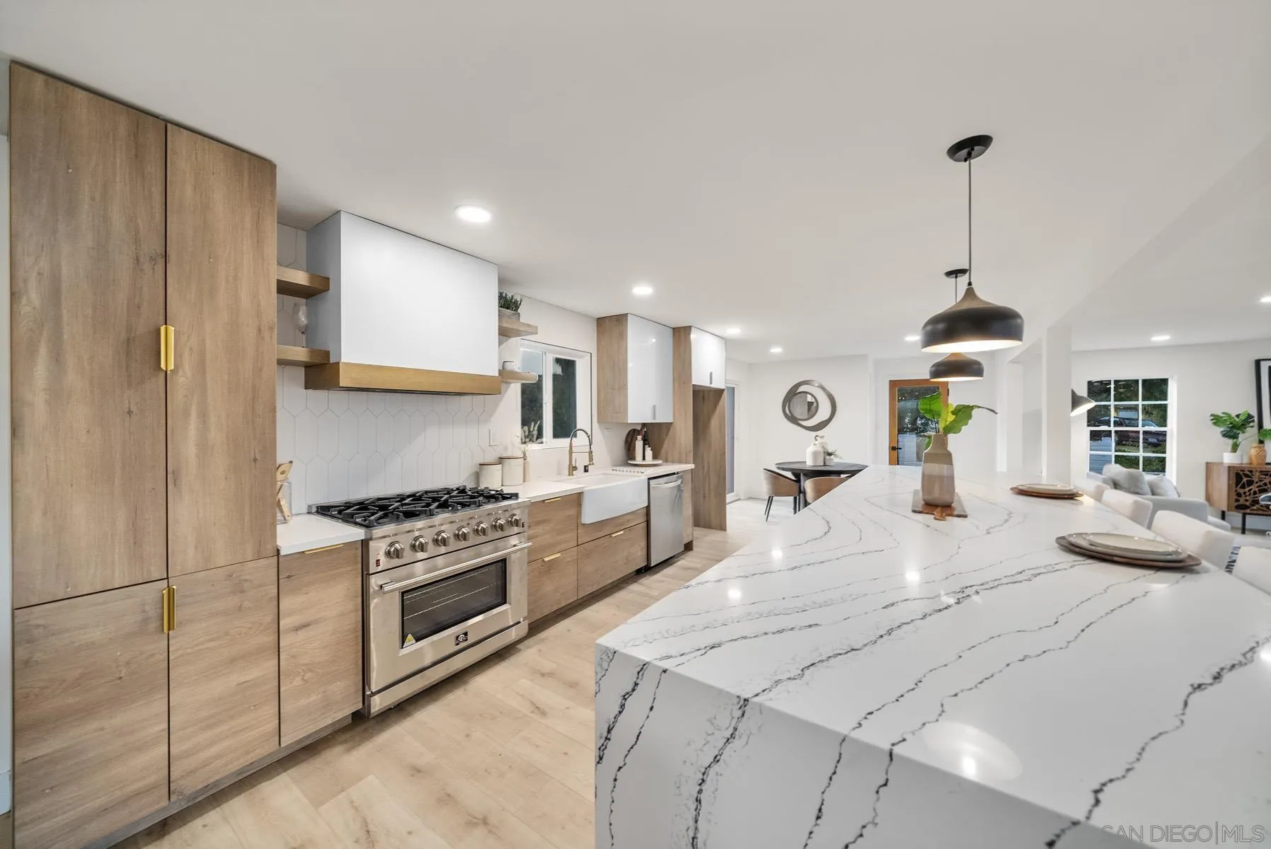 11442 Pinehurst Drive Lakeside, CA 92040 - Photo 10 of 46 a large kitchen with stainless steel appliances granite countertop a stove a sink dishwasher and a refrigerator with wooden floor