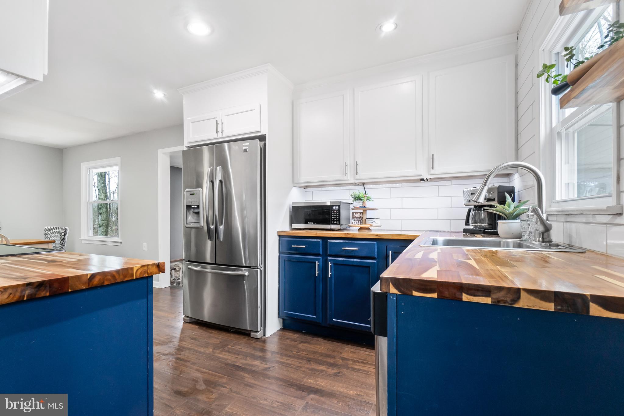 601 Red Toad Road North East, MD 21901 - Photo 9 of 25 Custom shelving & white subway tile backsplash