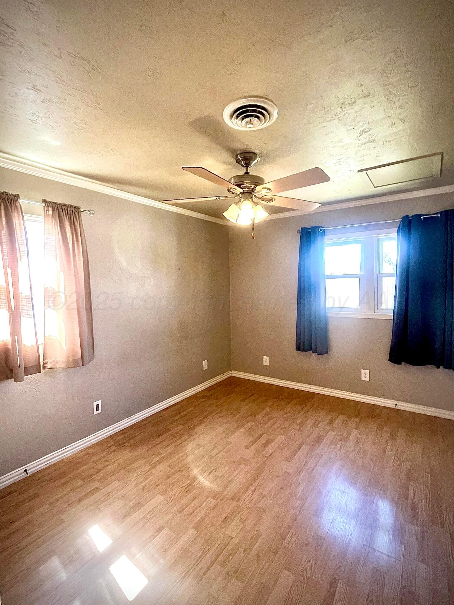 5116 Crockett Street Amarillo, TX 79110 - Photo 15 of 23 a view of an empty room and window