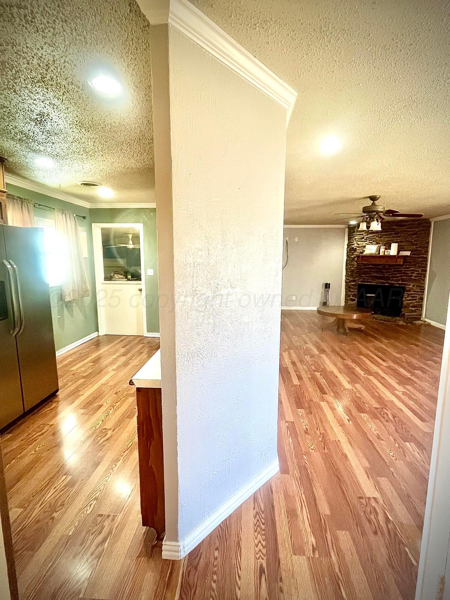5116 Crockett Street Amarillo, TX 79110 - Photo 17 of 23 a view of a living room and a bathroom